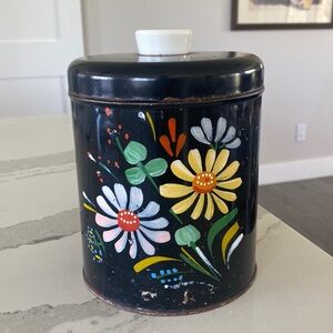 Vintage Ransburg black flower canister.